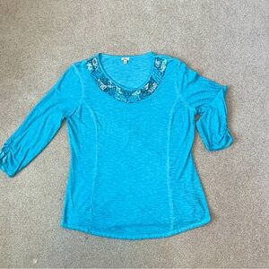 Reba size L  princess seam jersey with decorative neckline.